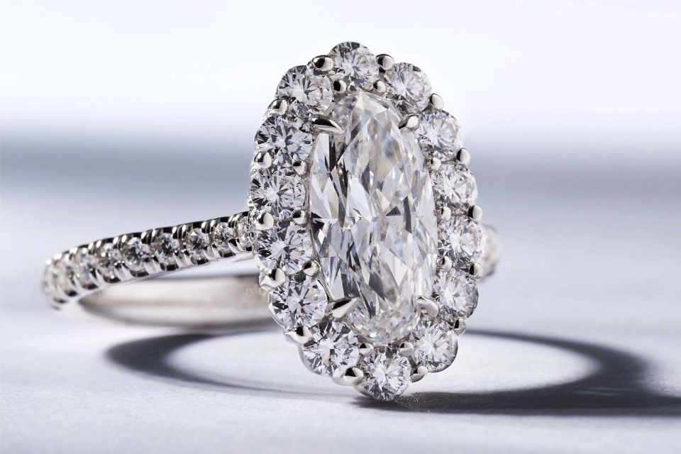 Diamond and Engagement Rings Columbus, OH - oval-cut diamond ring surrounded by diamonds with a diamond band