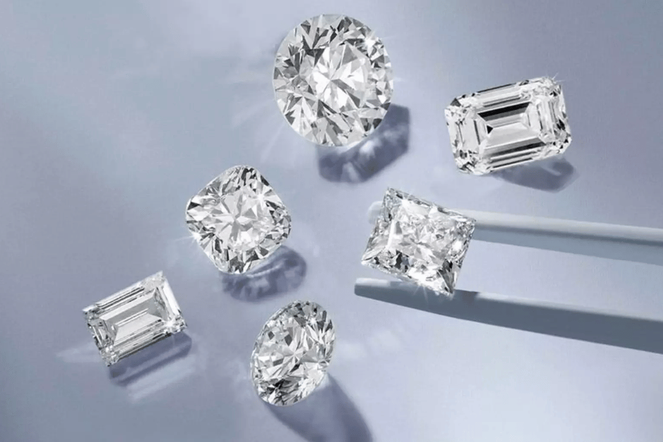 Lab Grown Diamonds Cincinnati, OH - loose diamonds on a grey background.